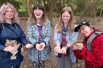 Wild Wellbeing Participants with their nature treasures