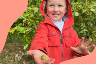 Child holding an acorn