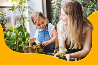 a woman and child potting plants together 