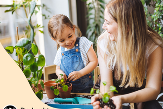 Child learning about plants with an adult