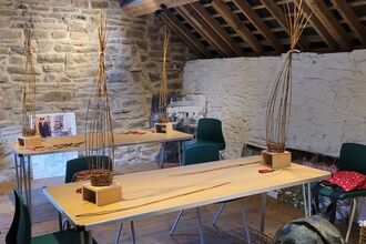 Willow Weaving Workshop, two tables with items weaved from willow on them.