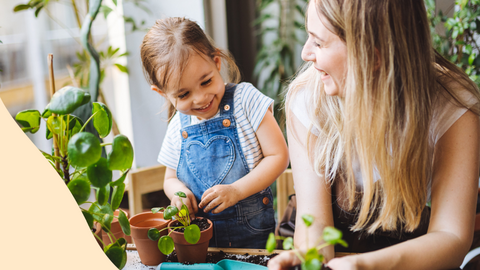 Child learning about plants with an adult
