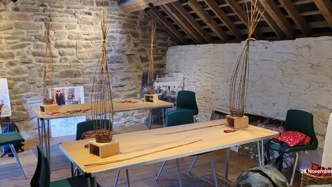 Willow Weaving Workshop, two tables with items weaved from willow on them.