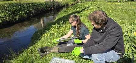 Species Recovery Officers, Frankie and Matt, with a sealent gun to check water samples for eDNA