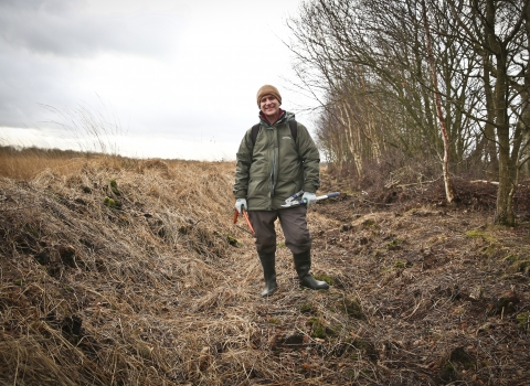 Tim standing in ditch