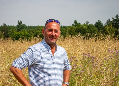 Guy in a field jordans