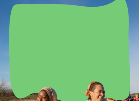 a group of people walking and smiling